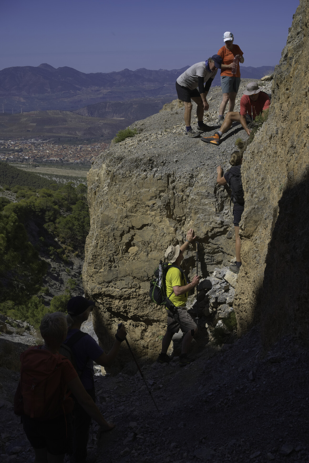 Some hikers have to surmount a small, awkward rock step.
