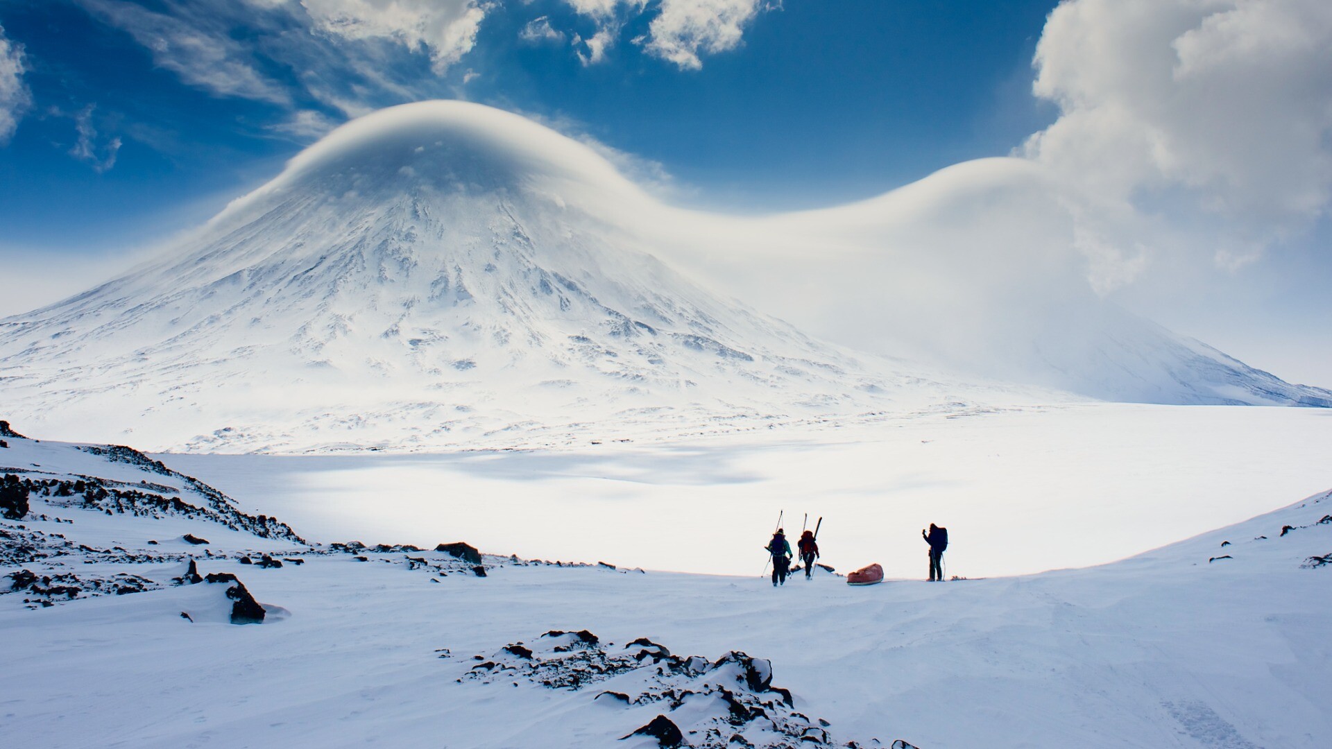 Klyuchevskaya Sopka mountain, Kamchatka, covered in lenticular clouds as we approach base camp