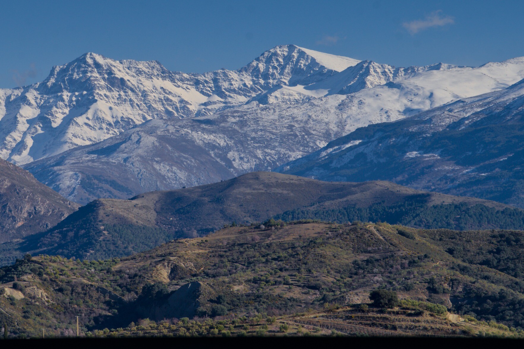 Distant view of some high snowy mountains 