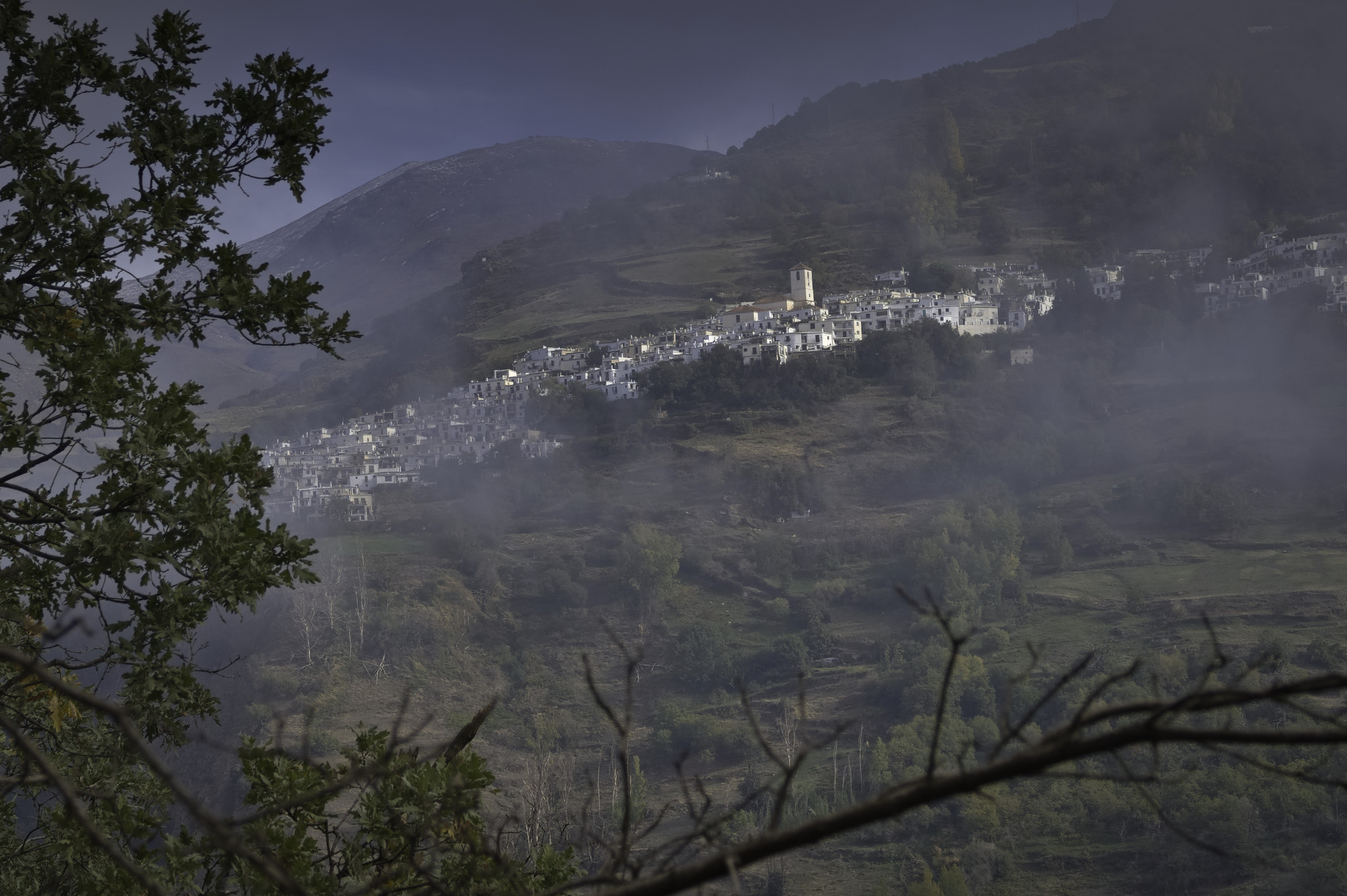 Morning cloud dissipating from the slopes around Capileira yesterday morning, the church prominent. Behind rises the peak of Mulhacén, 3482m