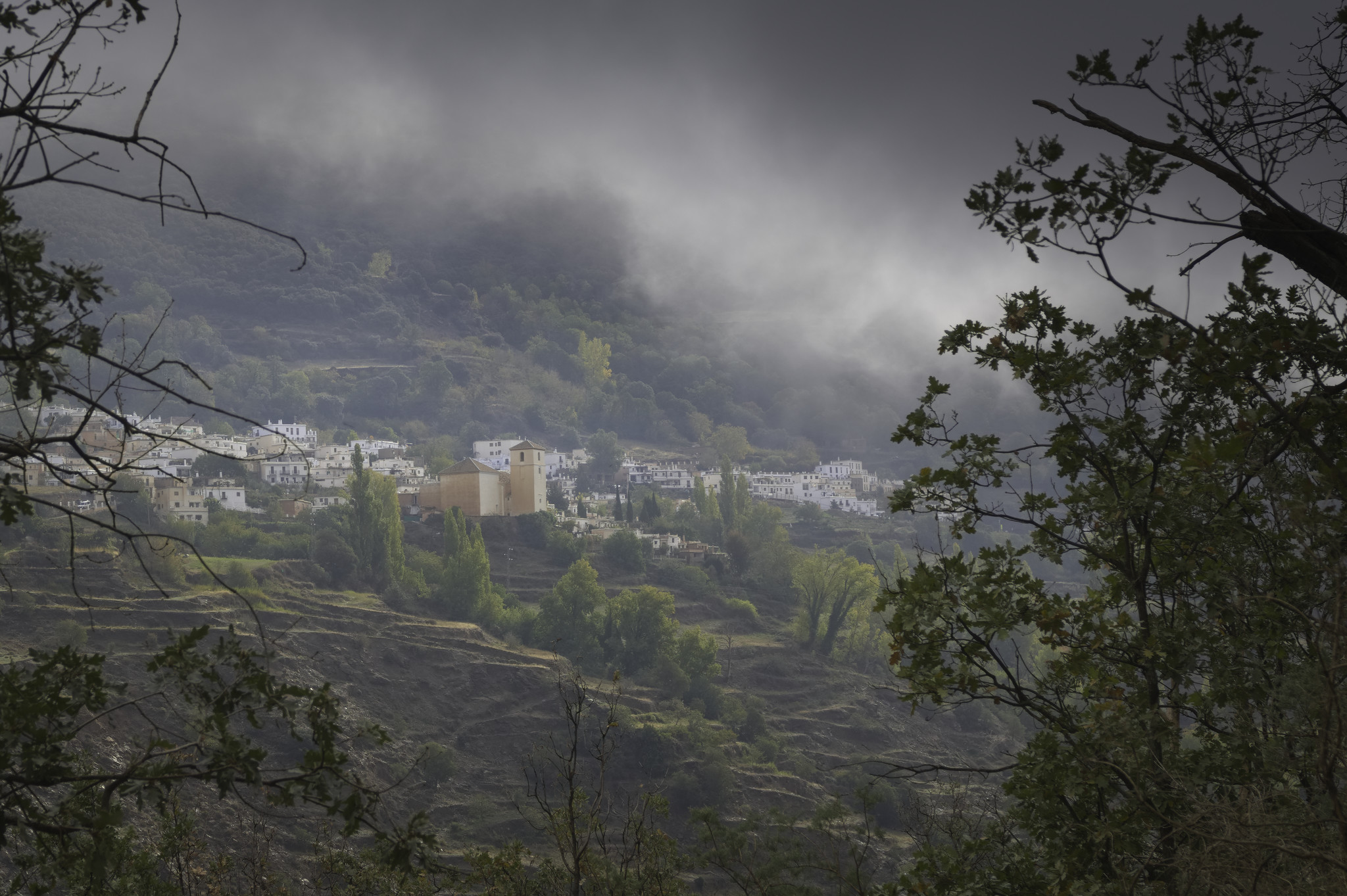The village of Bubion with thick cloud above