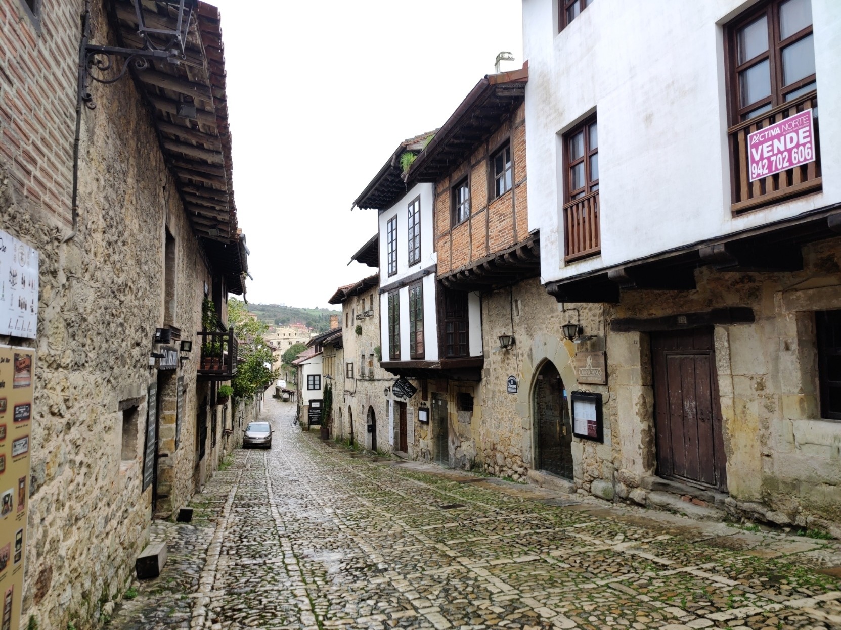 A narrow cobbled mediaeval street in northern Spain with olde worldly shops