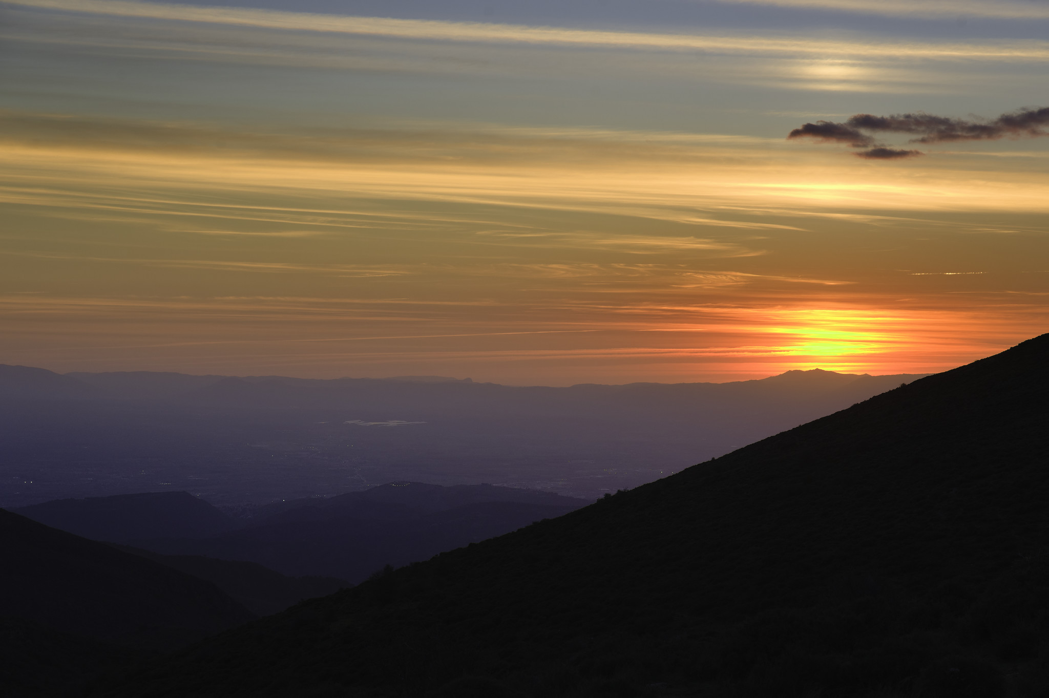 Just after sunset to the west of Granada the clouds light up with the setting sun