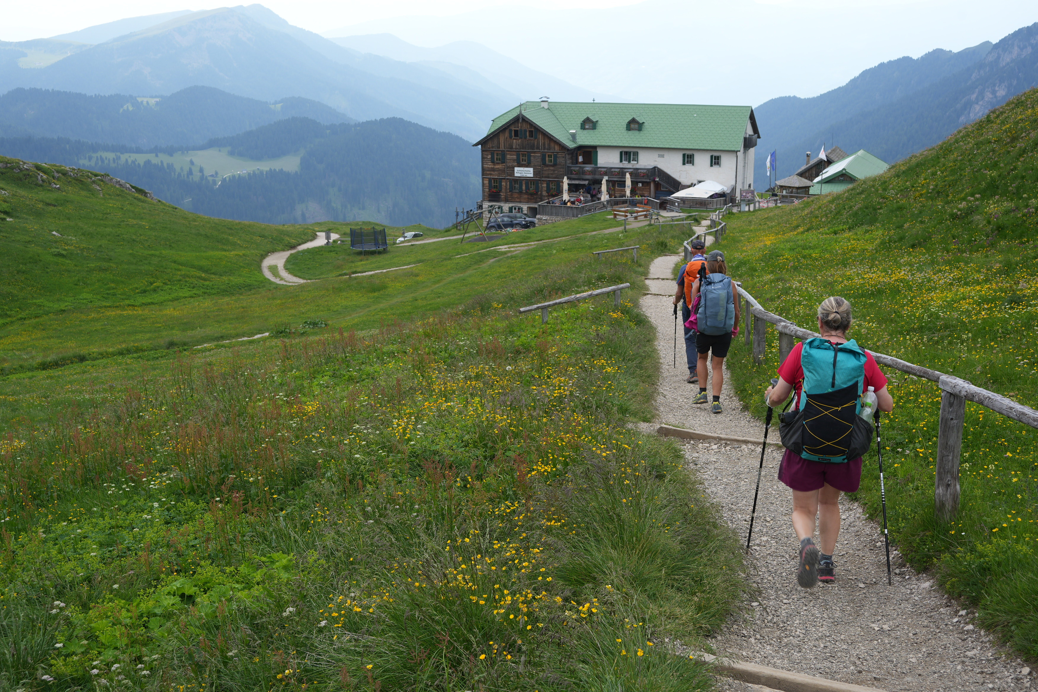 Hikers approach along  a trail to the Rifugio Genova