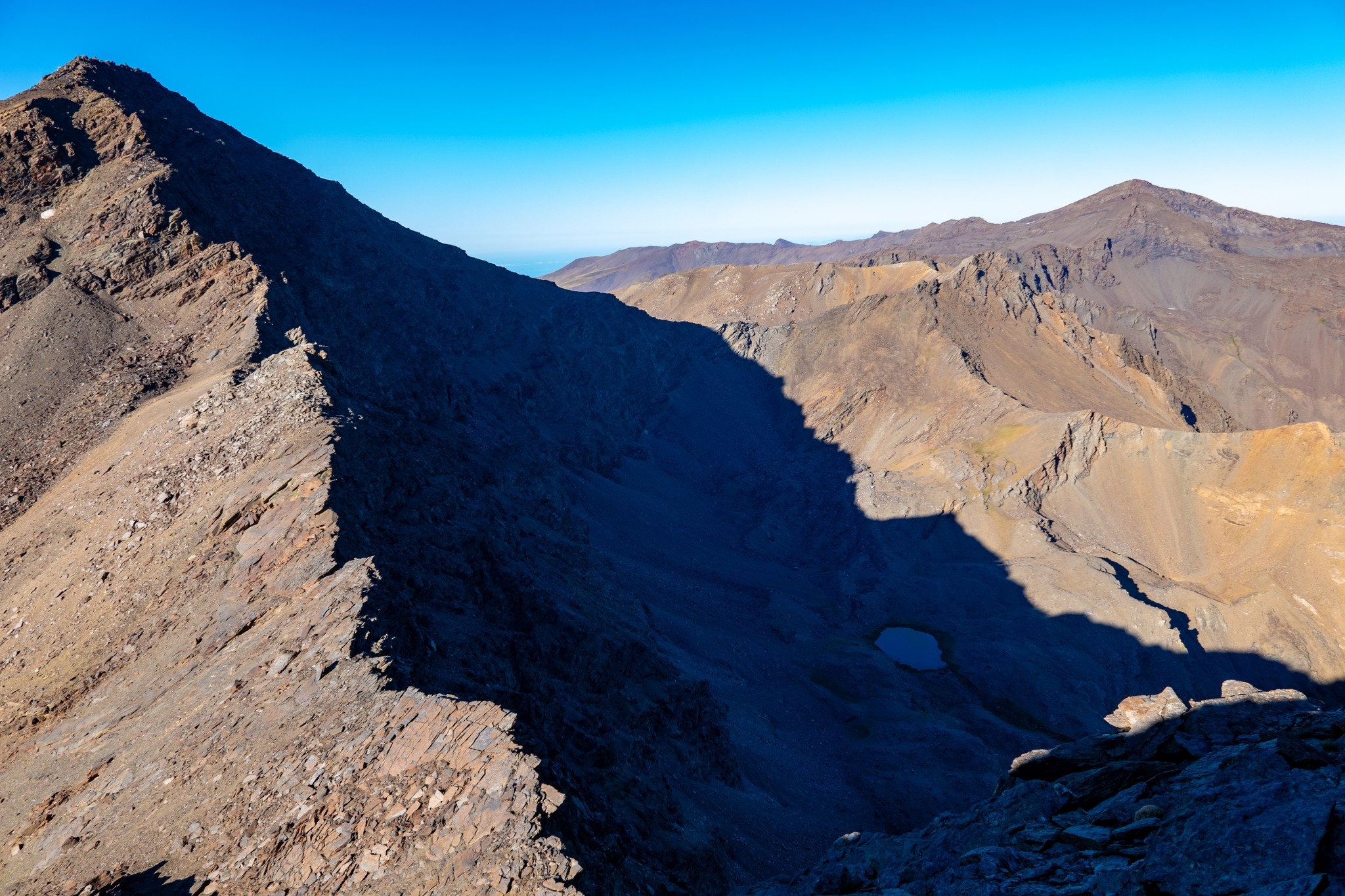 The NE ridge of Mulhacen from the Collado de Siete Lagunas highlighted in the morning sun.