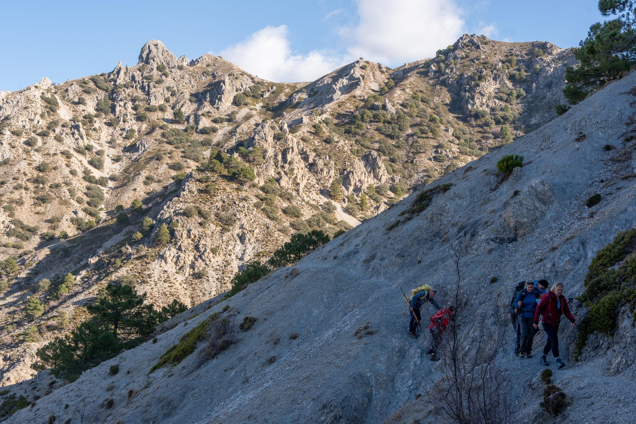 Some steep loose terrain on the traverse path. Corazon de la Sandia on the skyline