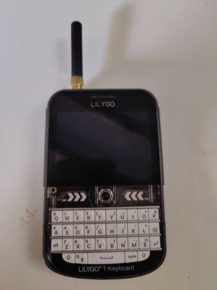 An image of a Lilygo T-Deck Plus radio with antenna