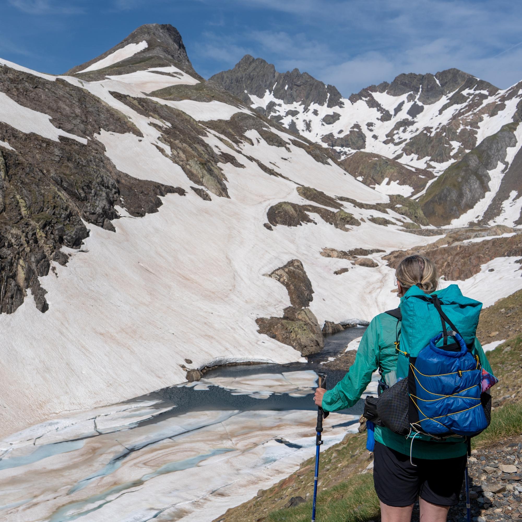 The lake of Ibón de Percico de la Canal and the peak of Punda Zarra 2944 covered in snow and ice