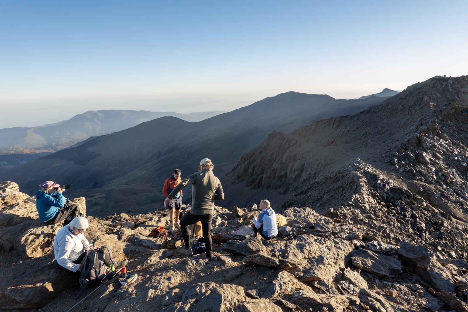 Hikers at the summit of Loma Pua enjoying the views