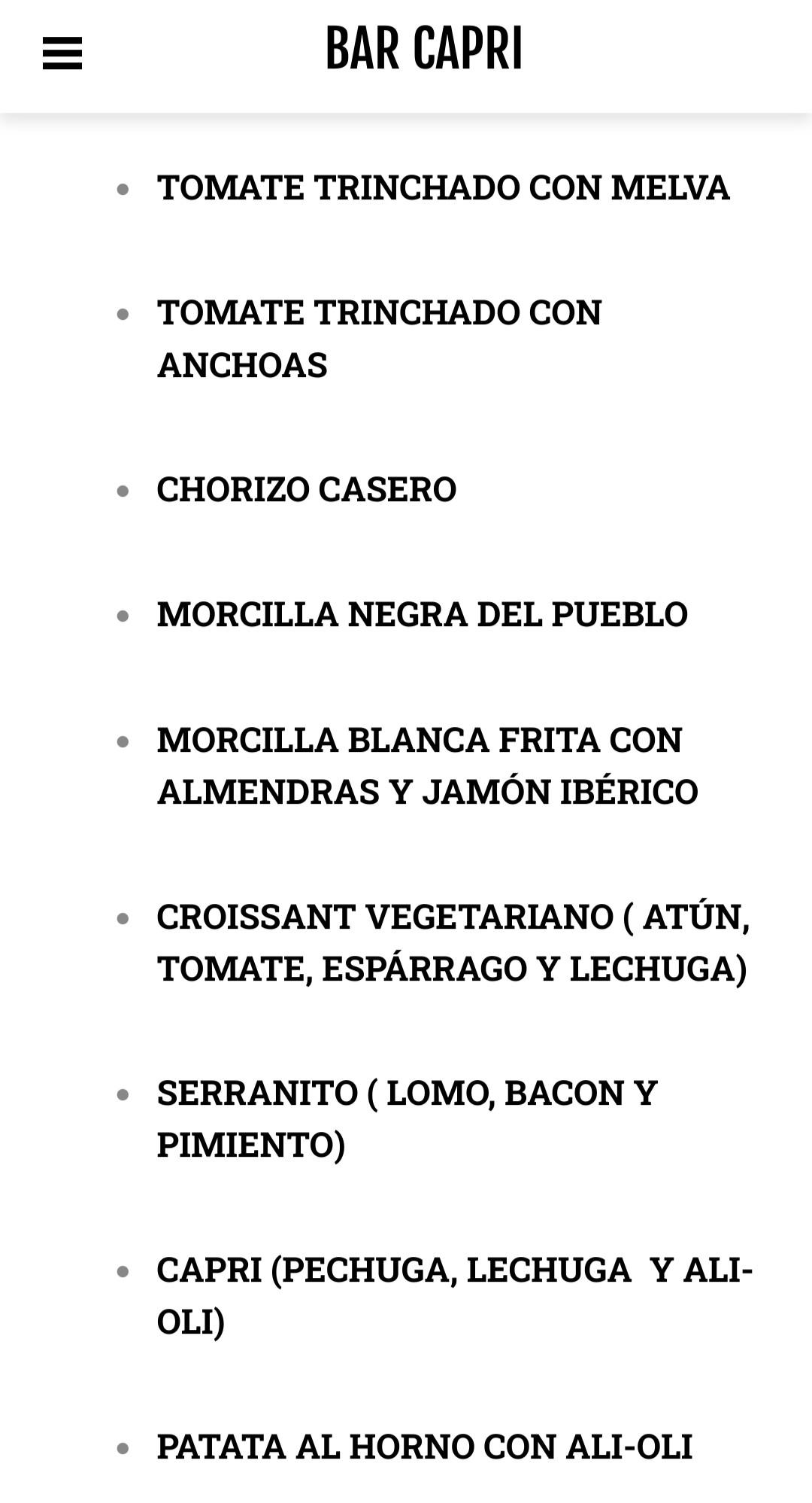 A black on white list of tapas available in a Spanish restaurant